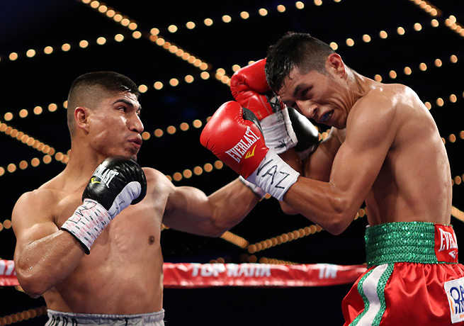 Mikey Garcia (left) was rarely seriously threatened by Juan Carlos Burgos during the fight. (Gregory Payan/AP)